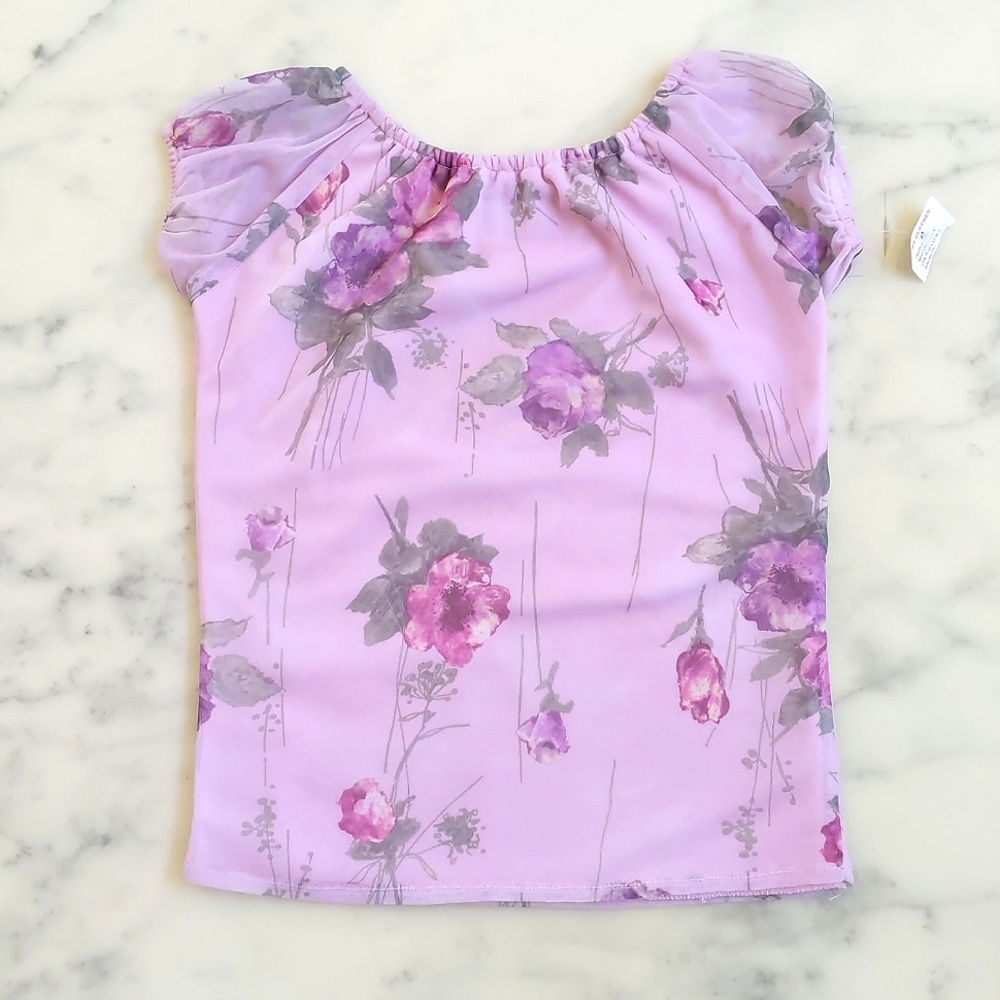 NWT. Sheer Short Sleeve Top with roses and lining.